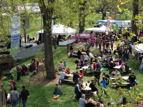Visitors enjoy local and organic eats in front of The Folk School Cafe Stage on April 21st.